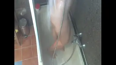 Real hidden cam catches neighbor woman masturbating in the shower.